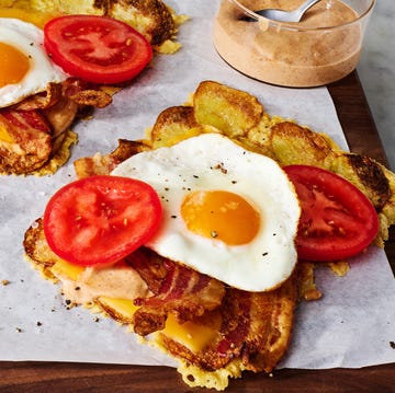 Crispy Potato Bacon, Egg, & Cheese smoky bacon a runny egg melty american cheese and spicy mayo are wrapped in a layer of parmesan crusted crispy potatoes