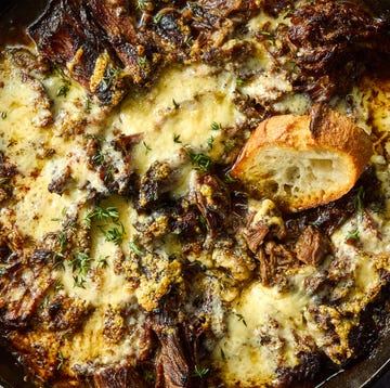 French Onion Pot Roast onion seasoned beef is nestled in a bed of cooked onions, red wine, fresh thyme, and beef broth, then braised until ridiculously tender, shredded, and topped with nutty, salty gruyere cheese