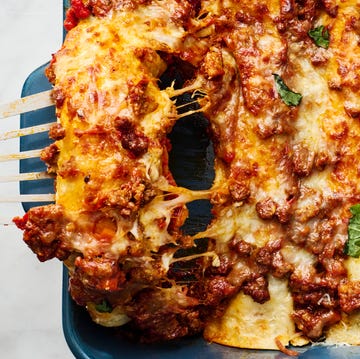 Lasangchiladas saucy beef bolognese, and herby ricotta rolled into flour tortillas and topped with more bolognese mozzarella and parmesan then baked until bubbly and perfect