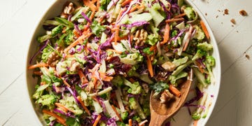 Broccoli Slaw broccoli slaw with cabbage, carrots, scallions, toasted walnuts, dried cranberries, and maple dijon dressing