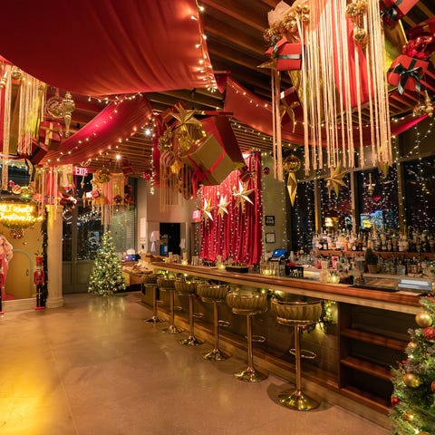 bar decorated for the holiday season with christmas trees and festive ornaments bar decorated for the holiday season with christmas trees and festive ornaments