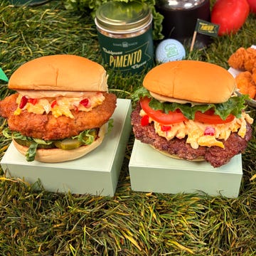 Food items featuring two burgers and a side of chicken bites. Food items featuring two burgers and a side of chicken bites.