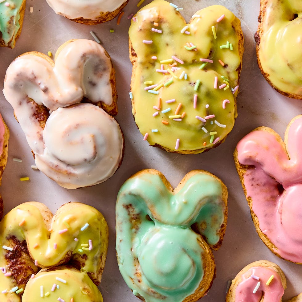 Easter Bunny Cinnamon Rolls cinnamon rolls shaped like a bunny iced with colored icing and topped with sprinkles