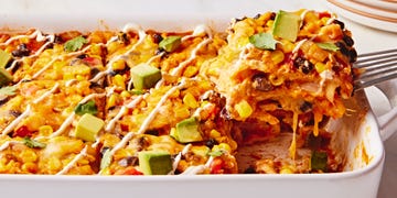 enchilada fillings in a casserole topped with avocado cubes