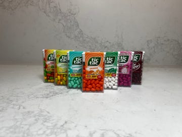 Assorted Tic Tac mint containers in a row. Assorted Tic Tac mint containers in a row.