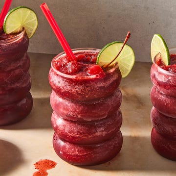 Frozen Cherry Coke Slushies cherry coke blended frozen slushies topped with a lime wedge and maraschino cherry
