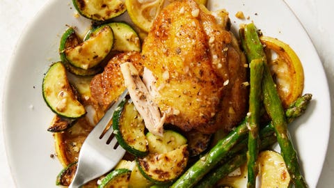 Garlicky Greek Chicken chicken thighs with roasted asparagus, zucchini, and lemons