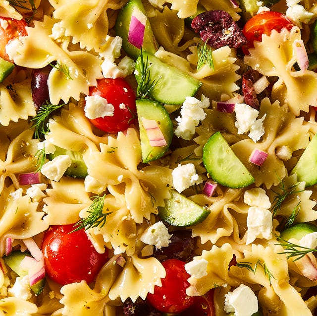 Greek Pasta Salad bowtie pasta tossed with cherry tomatoes, cucumbers, feta, and olives