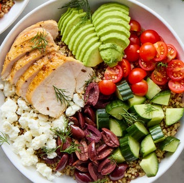 Greek Power Bowls bowls filled with chicken, tomatoes, cucumber, olives, feta, and avocado