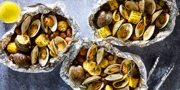 clams, corn, and potatoes in a grilled foil pack