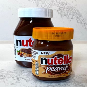jar of peanut nutella in front of jar of regular nutella jar of peanut nutella in front of jar of regular nutella
