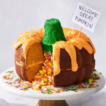 It's The Great Bundt-kin, Charlie Brown two pumpkin bundt cakes stacked on each other, filled with candy corn, and decorated to look like a pumpkin