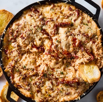 Marry Me Chicken Dip creamy chicken dip with sundried tomatoes in a skillet