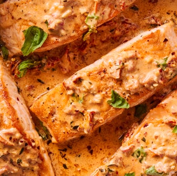 Marry Me Salmon Skillet salmon in a creamy sun dried tomato sauce topped with basil