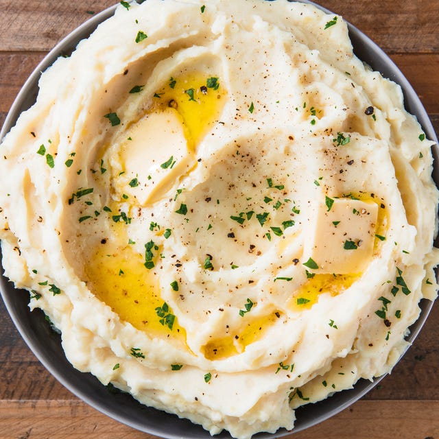 Mashed Potatoes topped with butter and herbs
