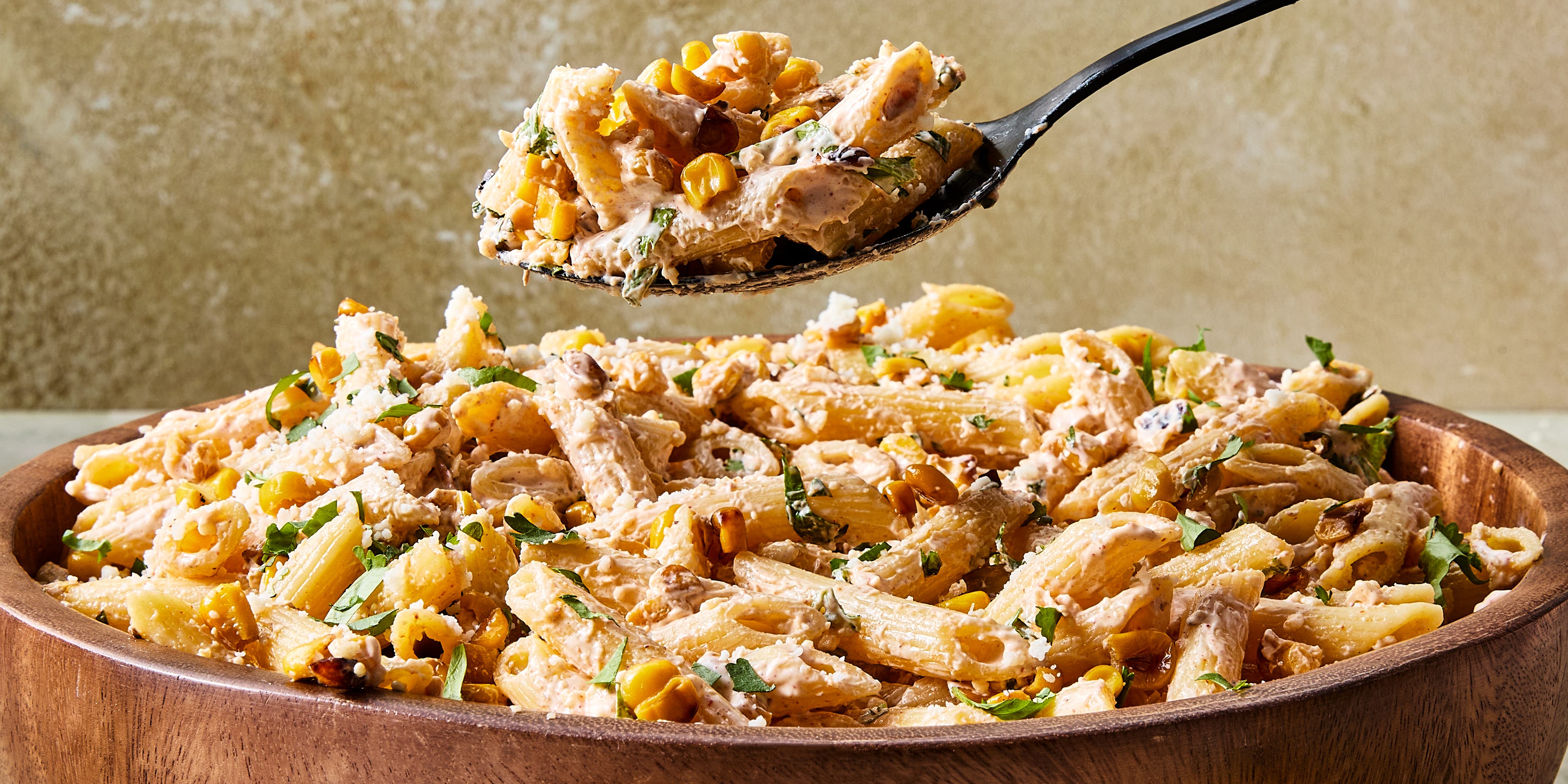 Mexican Street Corn Pasta Salad pasta salad tossed in a creamy sauce, corn, and cilantro