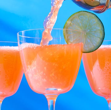 Naked & Famous naked and famous cocktail in a glass with a lime wheel