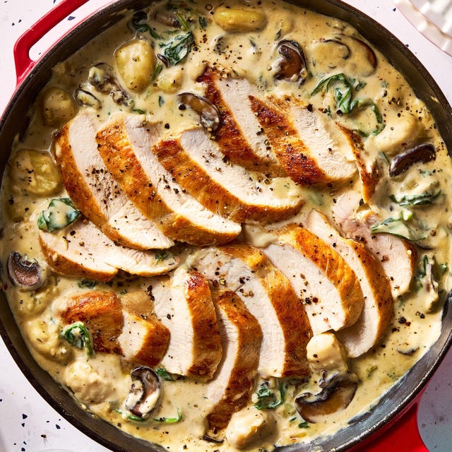 sliced chicken breast served in a creamy sauce with gnocchi and spinach sliced chicken breast served in a creamy sauce with gnocchi and spinach