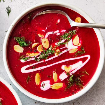 One Pot Harissa Beet Soup one pot harissa beet soup in a white bowl topped with almonds, herbs, and cream