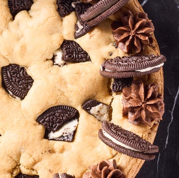 Oreo Cookie Cake cookie cake with oreos mixed in and on top with chocolate frosting