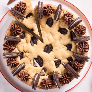 Oreo Cookie Cake cookie cake with oreos mixed in and on top with chocolate frosting