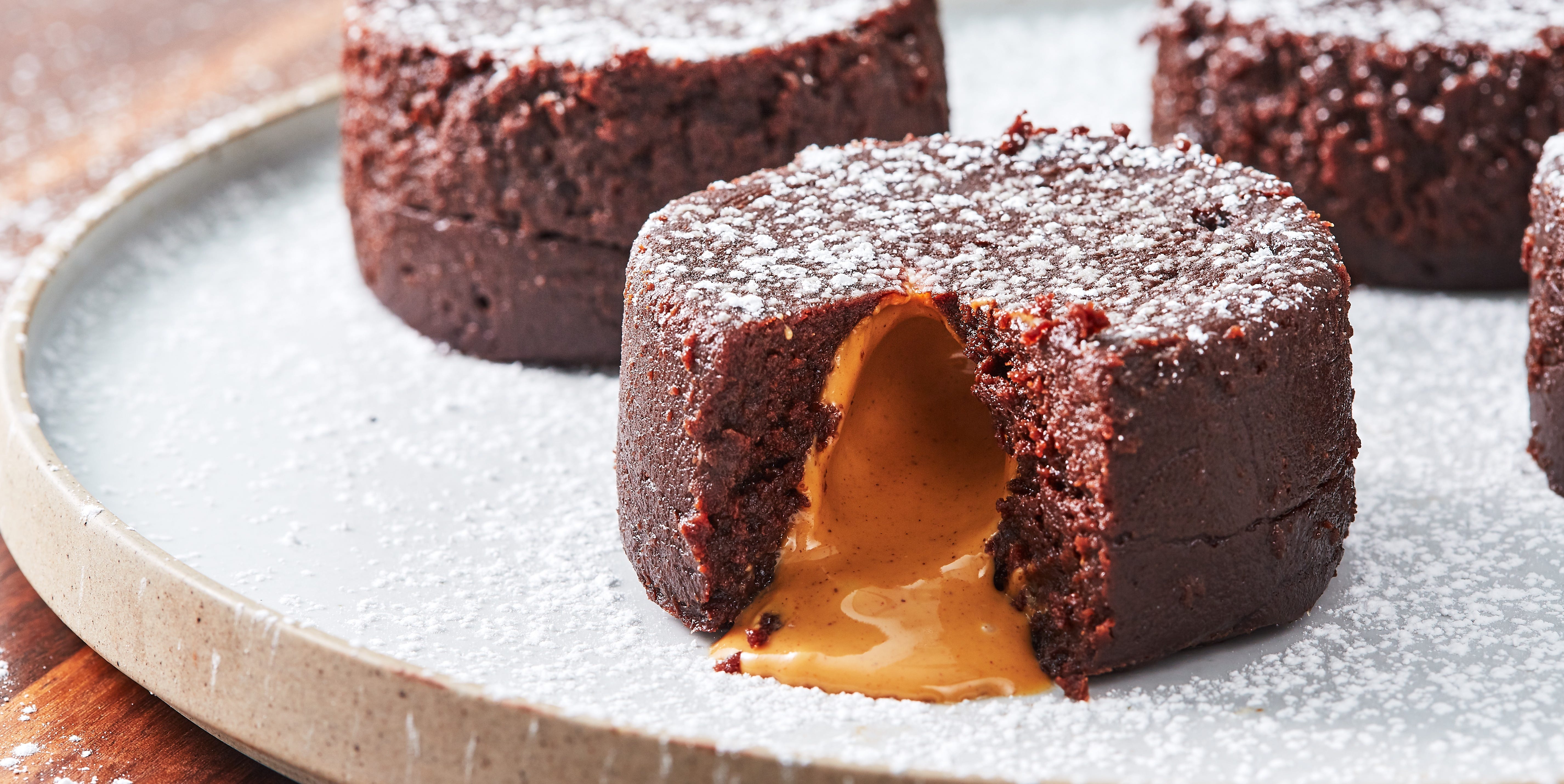 air fryer chocolate lava cakes filled with peanut butter and topped with powdered sugar air fryer chocolate lava cakes filled with peanut butter and topped with powdered sugar