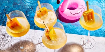 spritz with orange popsicles in them by a pool