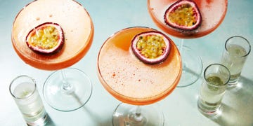 orange passion fruit martini garnished with a passionfruit