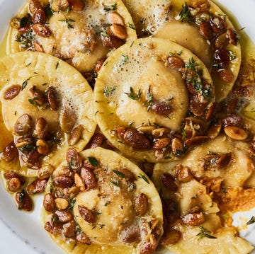 Pumpkin Ravioli pumpkin ravioli in a brown butter sauce and topped with pumpkin seeds and thyme