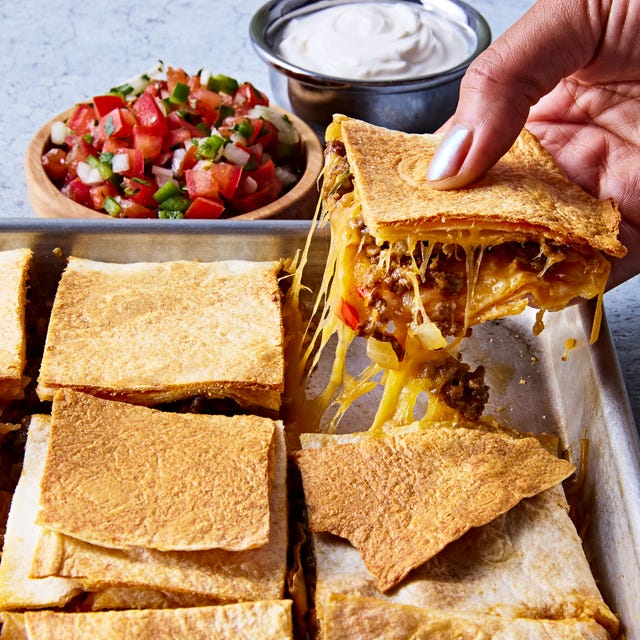 Sheet Pan Quesadillas tortillas filled with meat and cheese on a sheet pan