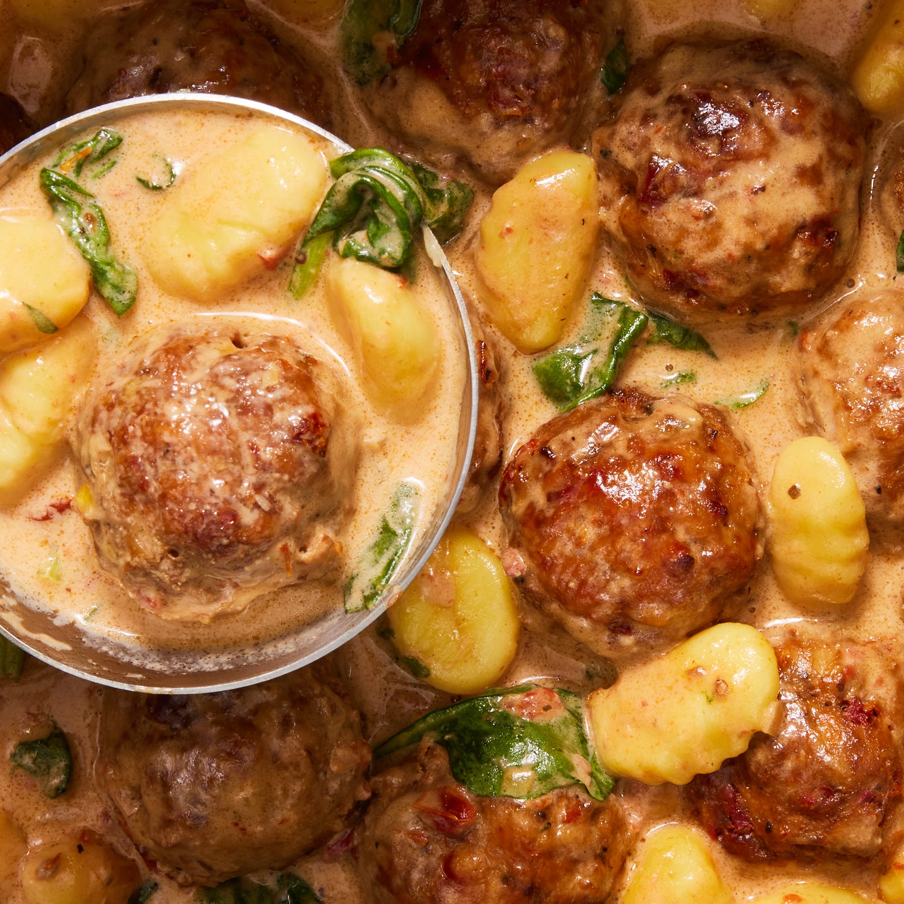 Slow Cooker Tuscan Chicken Meatballs wiTH Gnocchi chicken meatballs and gnocchi in a creamy tuscan sauce