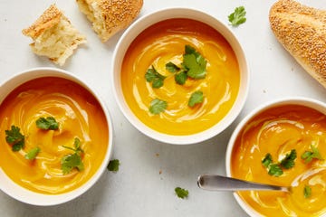 slowcooker vegan butternut squash soup garnished with coconut milk and cilantro