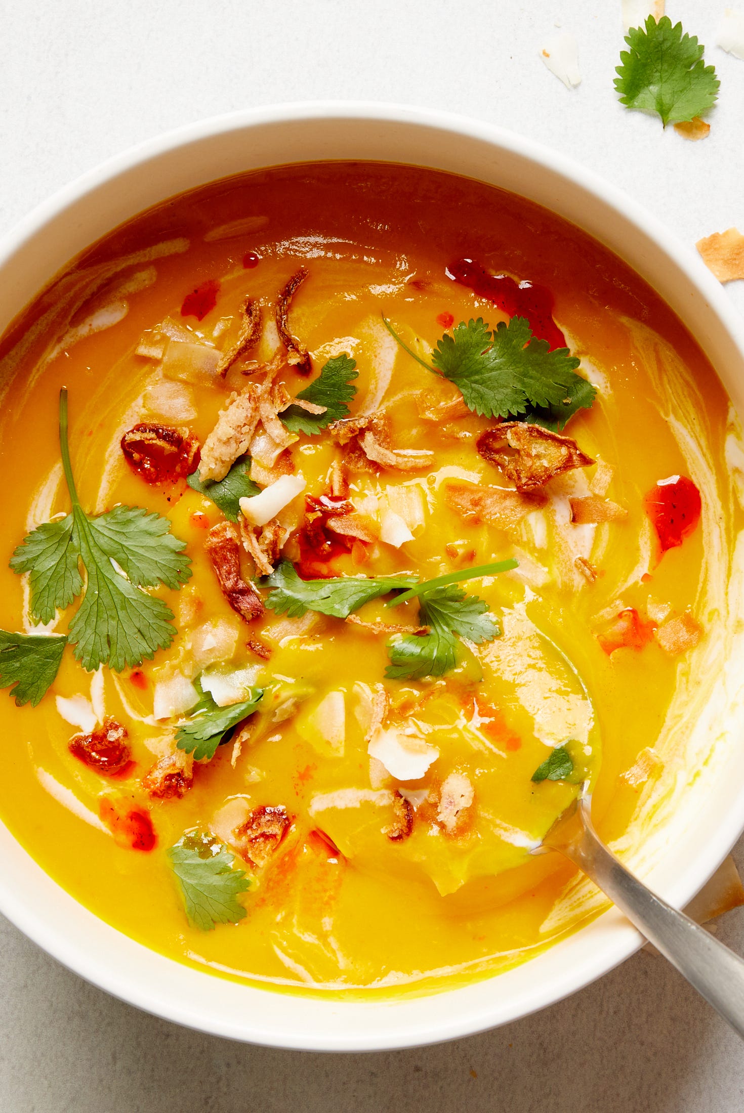 Slow-Cooker Vegan Butternut Squash Soup slowcooker vegan butternut squash soup garnished with coconut milk and cilantro