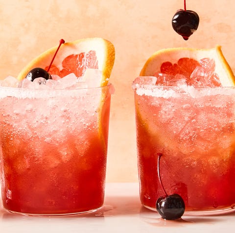 rocks glasses filled with ice, grapefruit juice, sour cherry juice, and tequila, garnished with grapefruit wheels and maraschino cherries rocks glasses filled with ice, grapefruit juice, sour cherry juice, and tequila, garnished with grapefruit wheels and maraschino cherries