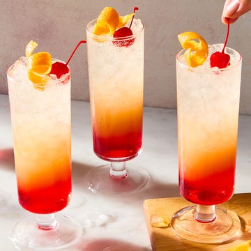 Sparkling Tequila Sunrise sparkling tequila sunrise with a cherry and orange peel