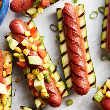 Zucchini Hot Dogs grilled hot dogs in between grilled zucchini topped with avocado salsa