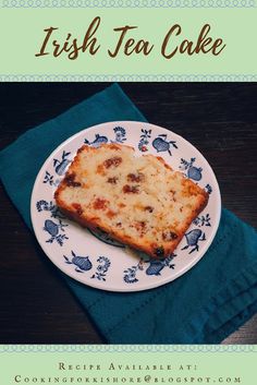 there is a piece of cake on a blue and white plate with the words irish tea cake
