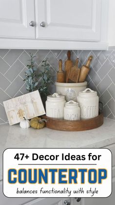 a kitchen counter with white cabinets and wooden utensils