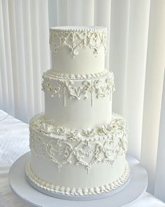 Had the absolute honor of creating this cake for my sister’s wedding last week! Scroll to see the final look, with wafer leaves. We assembled the top tier on site.   Every detail was piped freestyle by hand. From the vintage piping to roses to wafer detailing, it was a true labor of love. Couldn’t be happier with how it turned out.   #studiosweetly #weddingcakes #vintageweddingcake #nycwedding #nycbride #cakedecorating #vintagecake #floralcake #elegantcakes #cakedesign #cakecakecake #nycakes ... Vintage Wedding Cake 3 Tier, Wedding Cake Designs Vintage, Vintage Piping, Filigree Cake, Wedding Cake 3 Tier, Wedding Cake Vintage Elegant, Vintage Wedding Cakes Elegant, Antique Wedding Cake, Victorian Cake Design