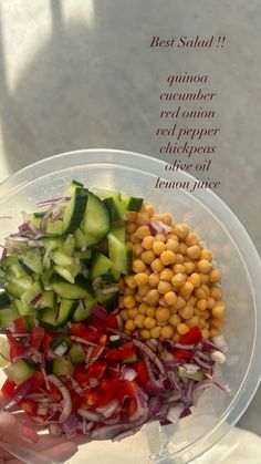 a person holding a plastic bowl filled with different types of vegetables and veggies