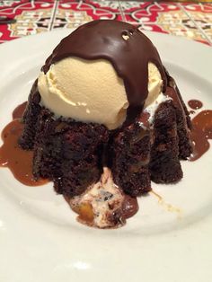 a chocolate dessert with ice cream on top