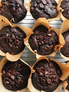 several chocolate muffins sitting on top of each other