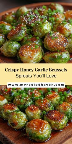 brussel sprouts with sesame seeds on a wooden platter and the words crispy honey garlic brussels sprouts you'll love