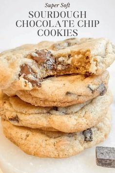 chocolate chip cookies stacked on top of each other with the words super soft sourdough chocolate chip cookies