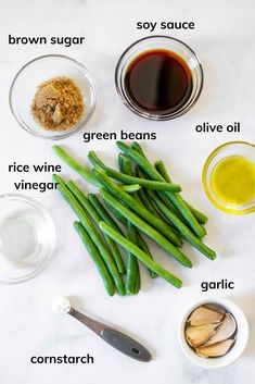 the ingredients for green beans are laid out on a table