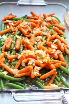 carrots and green beans in a glass dish