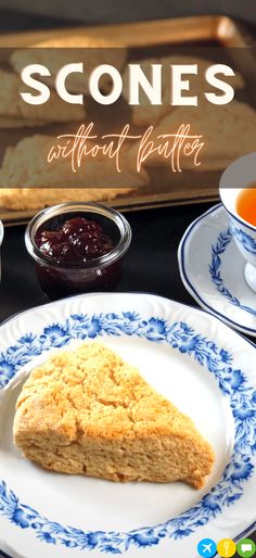 scones on a plate with jam and butter next to it, along with a cup of tea