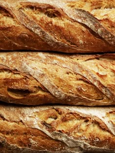 several loaves of bread stacked on top of each other