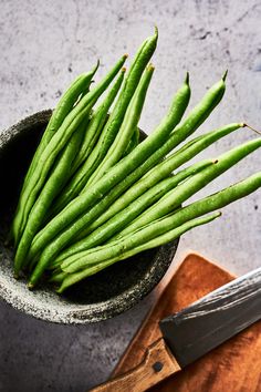 some green beans are in a small bowl