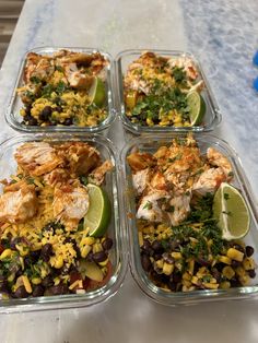 four plastic containers filled with different types of food
